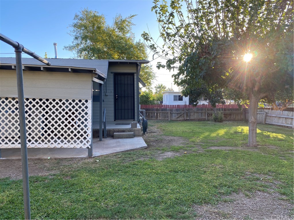 213 Elm Road Blythe, CA 92225 - Photo 42 of 61 a front view of a house with a yard