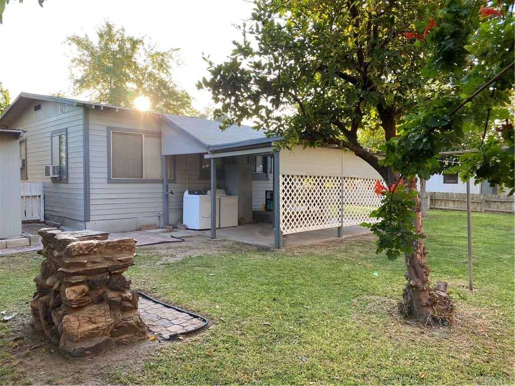 213 Elm Road Blythe, CA 92225 - Photo 43 of 61 a view of a house with a yard and a large tree