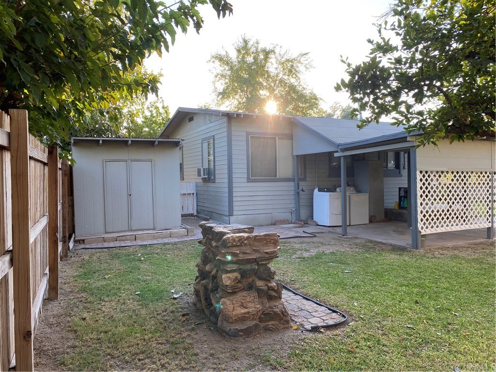 213 Elm Road Blythe, CA 92225 - Photo 44 of 61 a view of a backyard with a large tree
