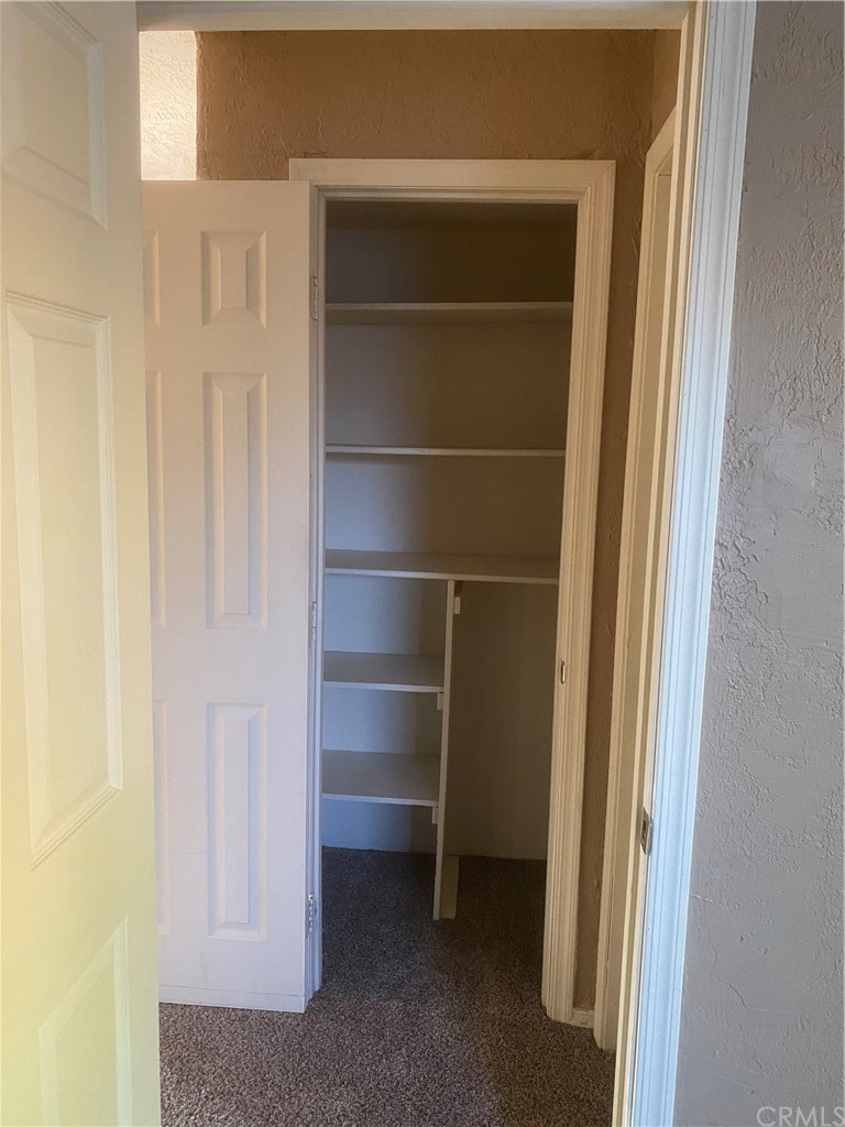 213 Elm Road Blythe, CA 92225 - Photo 47 of 61 a view of walk in closet with empty racks