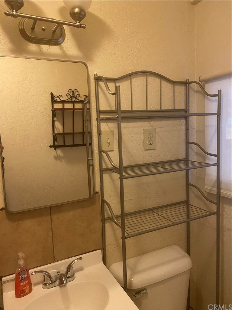 213 Elm Road Blythe, CA 92225 - Photo 58 of 61 a bathroom with a shower and a sink