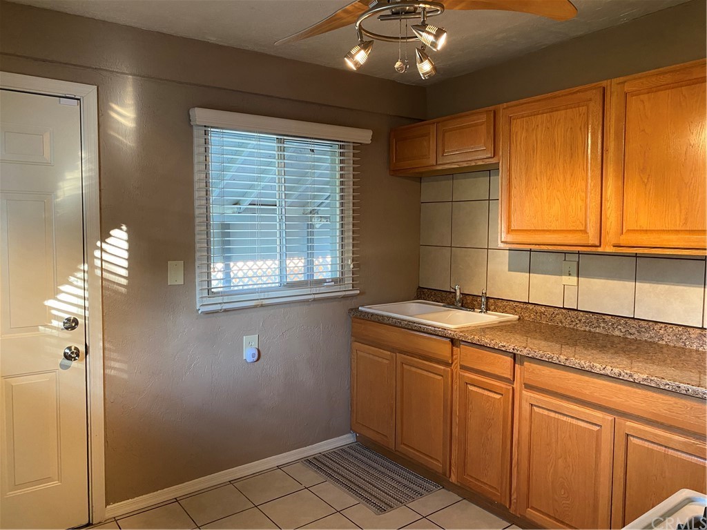 213 Elm Road Blythe, CA 92225 - Photo 61 of 61 a kitchen with a sink cabinets and window