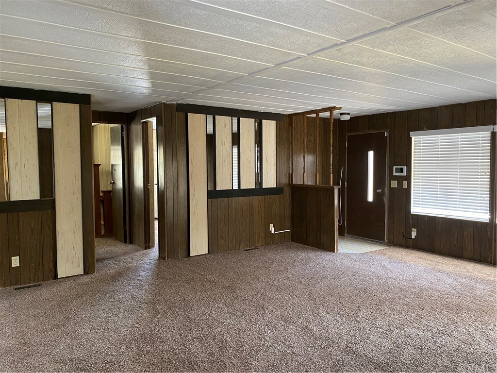 213 Elm Road Blythe, CA 92225 - Photo 8 of 61 an empty room with closet and windows