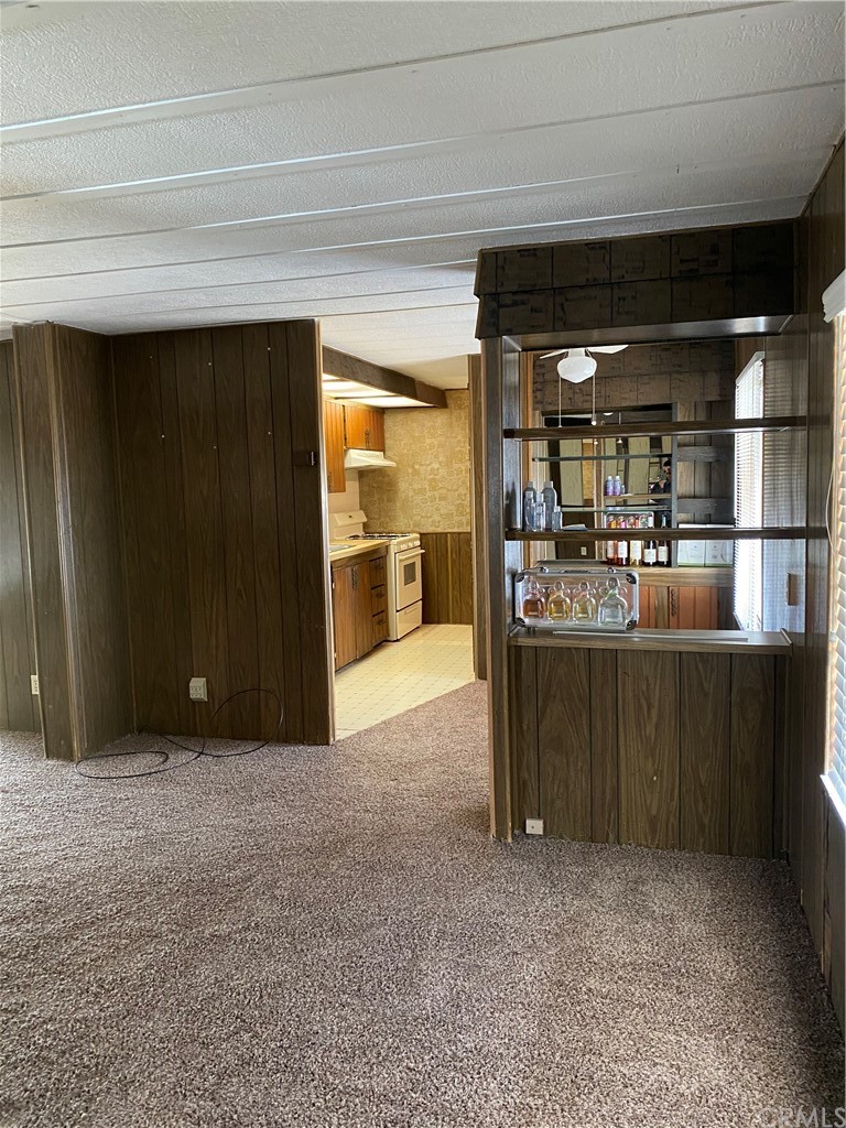 213 Elm Road Blythe, CA 92225 - Photo 9 of 61 a room with stainless steel appliances kitchen island granite countertop a refrigerator and a stove top oven