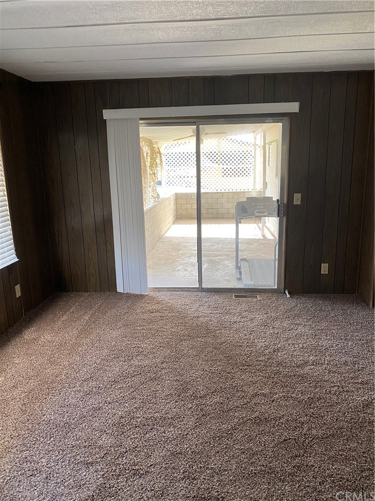213 Elm Road Blythe, CA 92225 - Photo 10 of 61 a view of empty room with wooden floor and fan