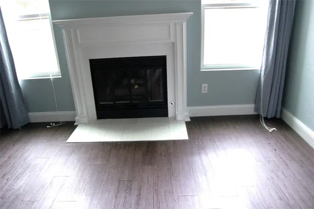 a view of fireplace and wooden floor