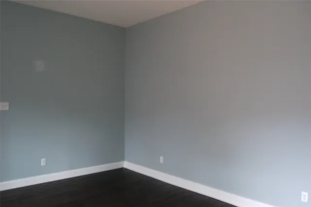 a view of a deck with wooden floor and outdoor seating