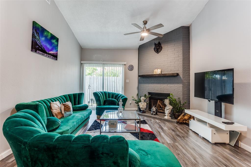 3801 14th Street, Unit 502 Plano, TX 75074 - Photo 2 of 12 a living room with furniture fireplace and flat screen tv