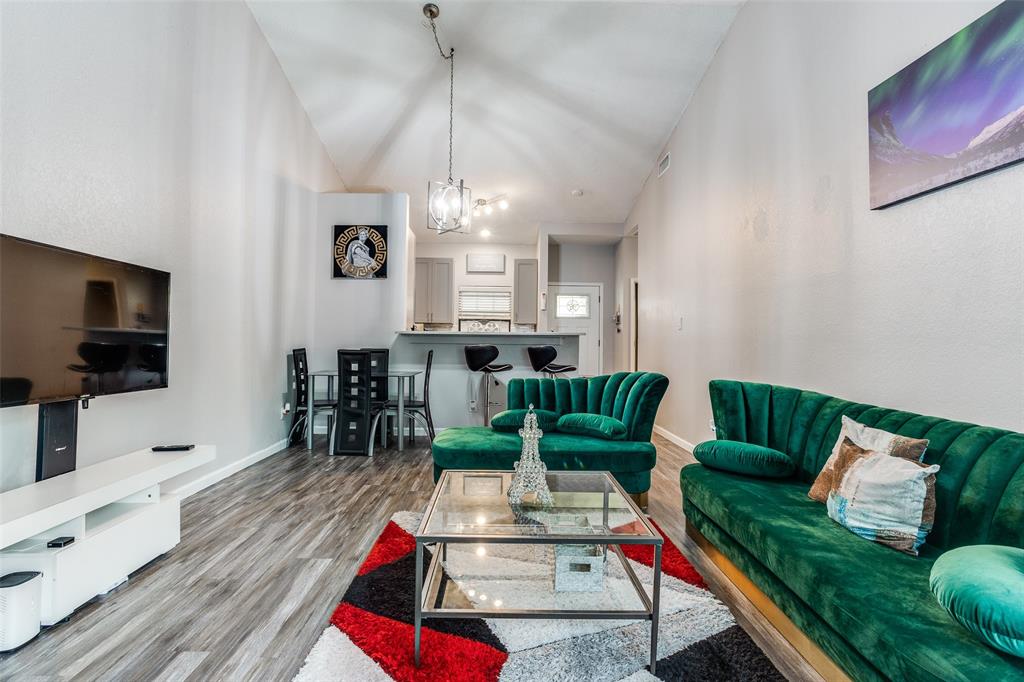 3801 14th Street, Unit 502 Plano, TX 75074 - Photo 5 of 12 a living room with furniture and a flat screen tv