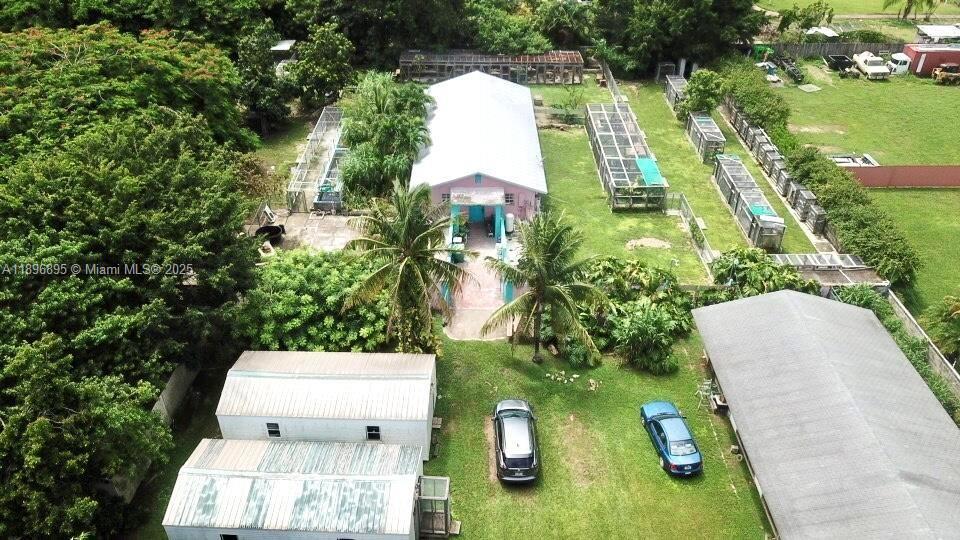 35000 Southwest 212th Avenue Homestead, FL 33034 - Photo 2 of 11 a view of a multi story residential apartment building with a yard