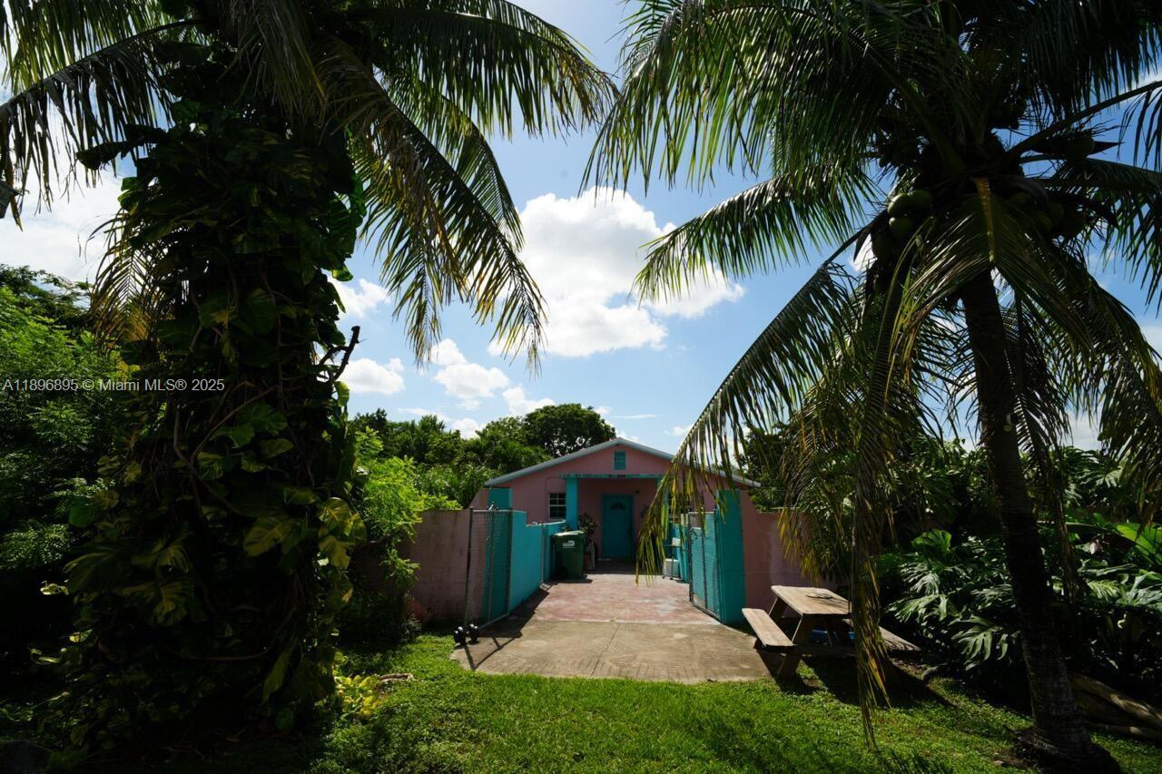 35000 Southwest 212th Avenue Homestead, FL 33034 - Photo 4 of 11 a view of a backyard with a plants