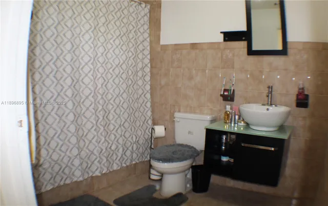 a bathroom with a toilet and a sink