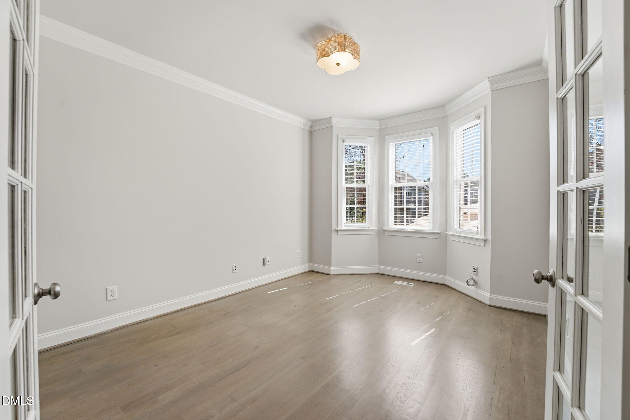 2900 SnapsWell Street Raleigh, NC 27614 - Photo 13 of 40 an empty room with wooden floor and windows