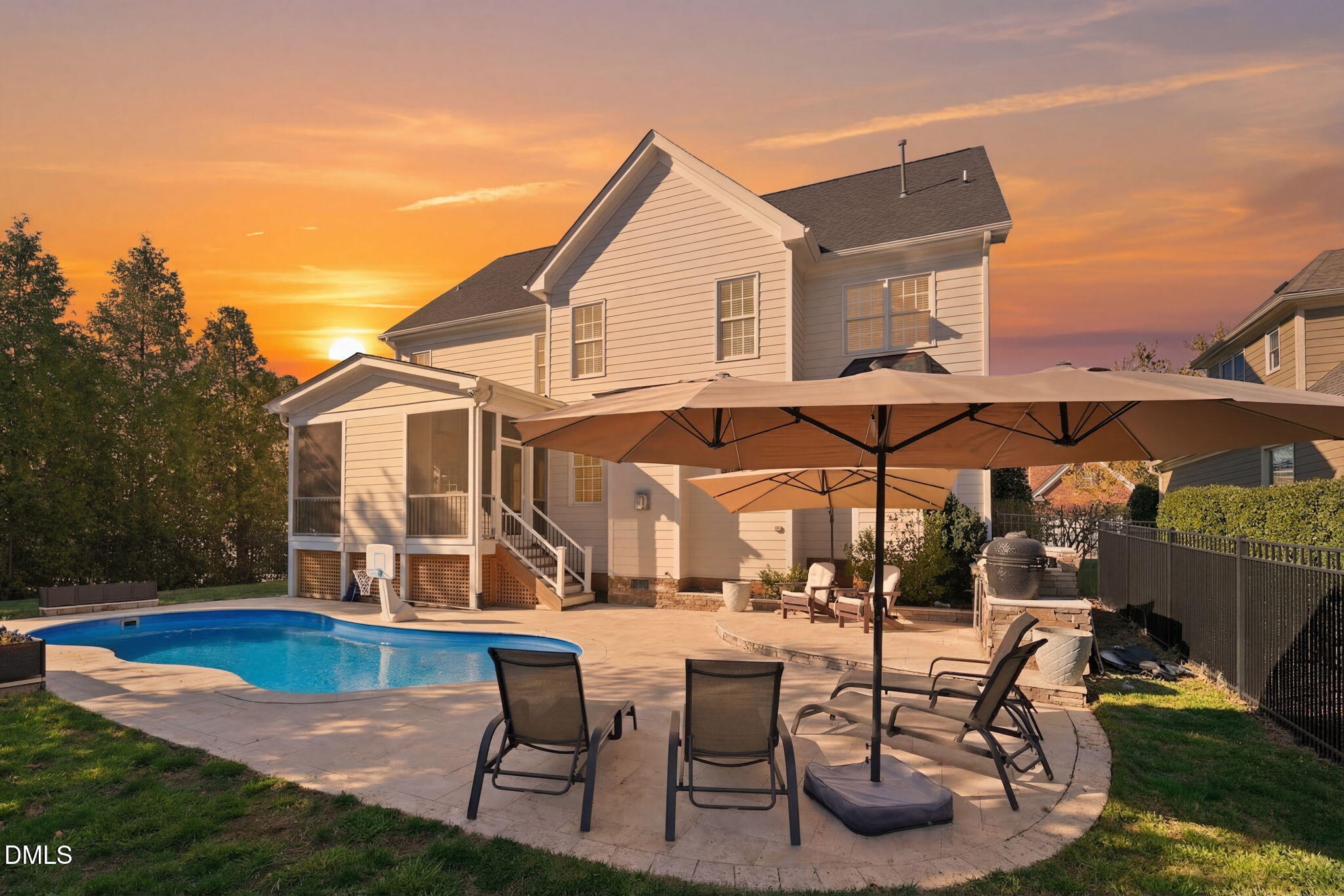 2900 SnapsWell Street Raleigh, NC 27614 - Photo 16 of 40 a patio with a table and chairs under an umbrella