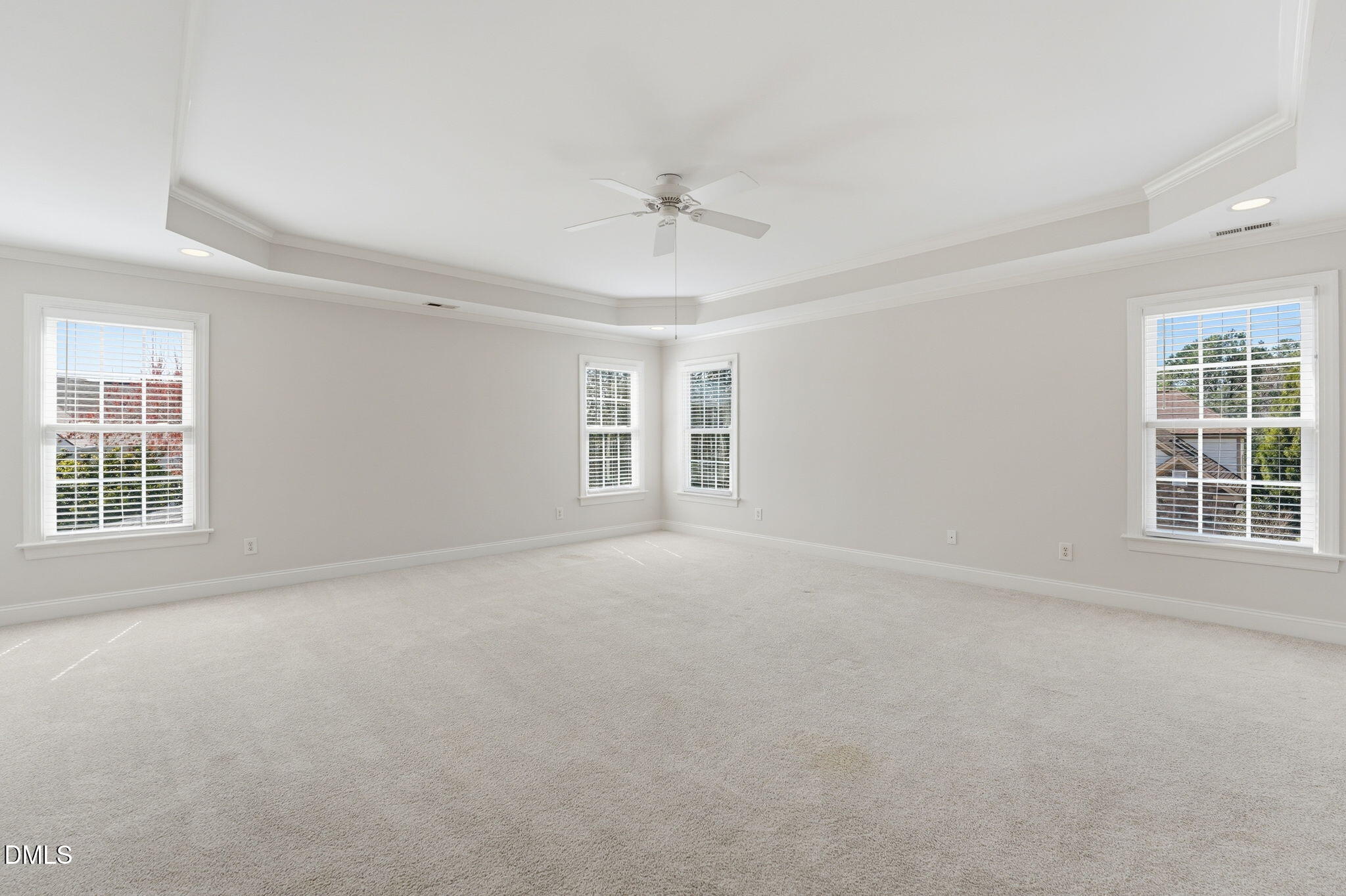 2900 SnapsWell Street Raleigh, NC 27614 - Photo 20 of 40 en empty room with windows and ceiling fan