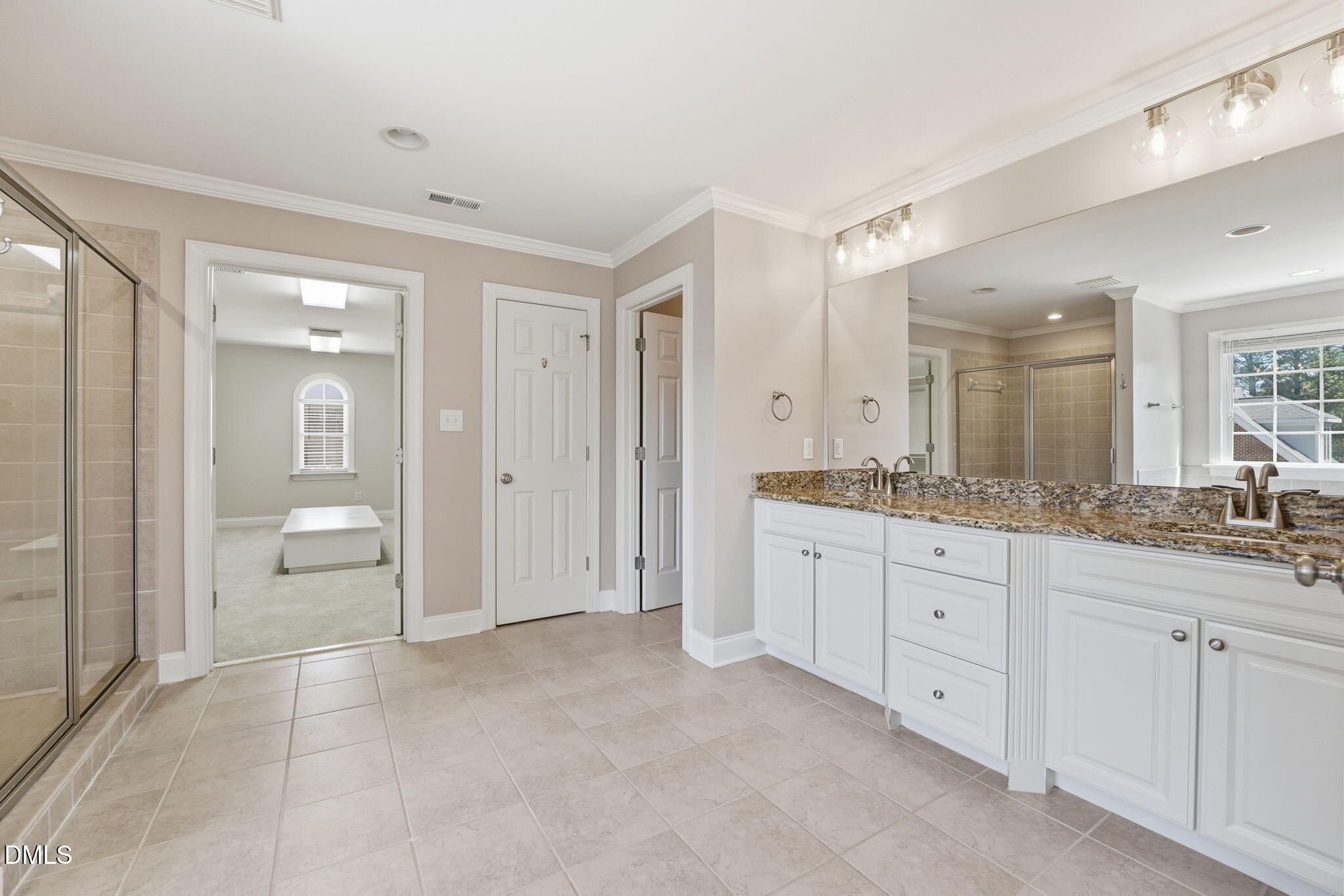 2900 SnapsWell Street Raleigh, NC 27614 - Photo 23 of 40 a spacious bathroom with a granite countertop sink a mirror and a bathtub
