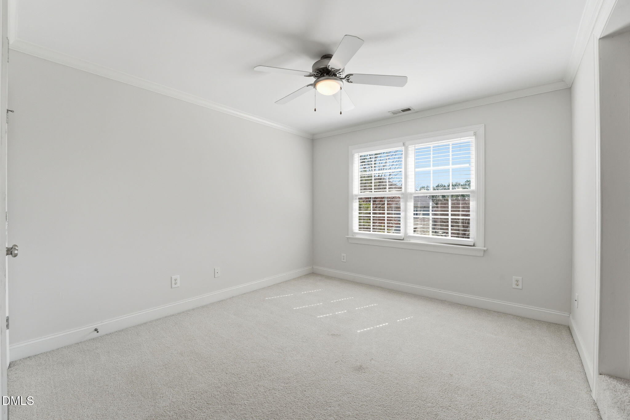 2900 SnapsWell Street Raleigh, NC 27614 - Photo 29 of 40 an empty room with a window and a ceiling fan