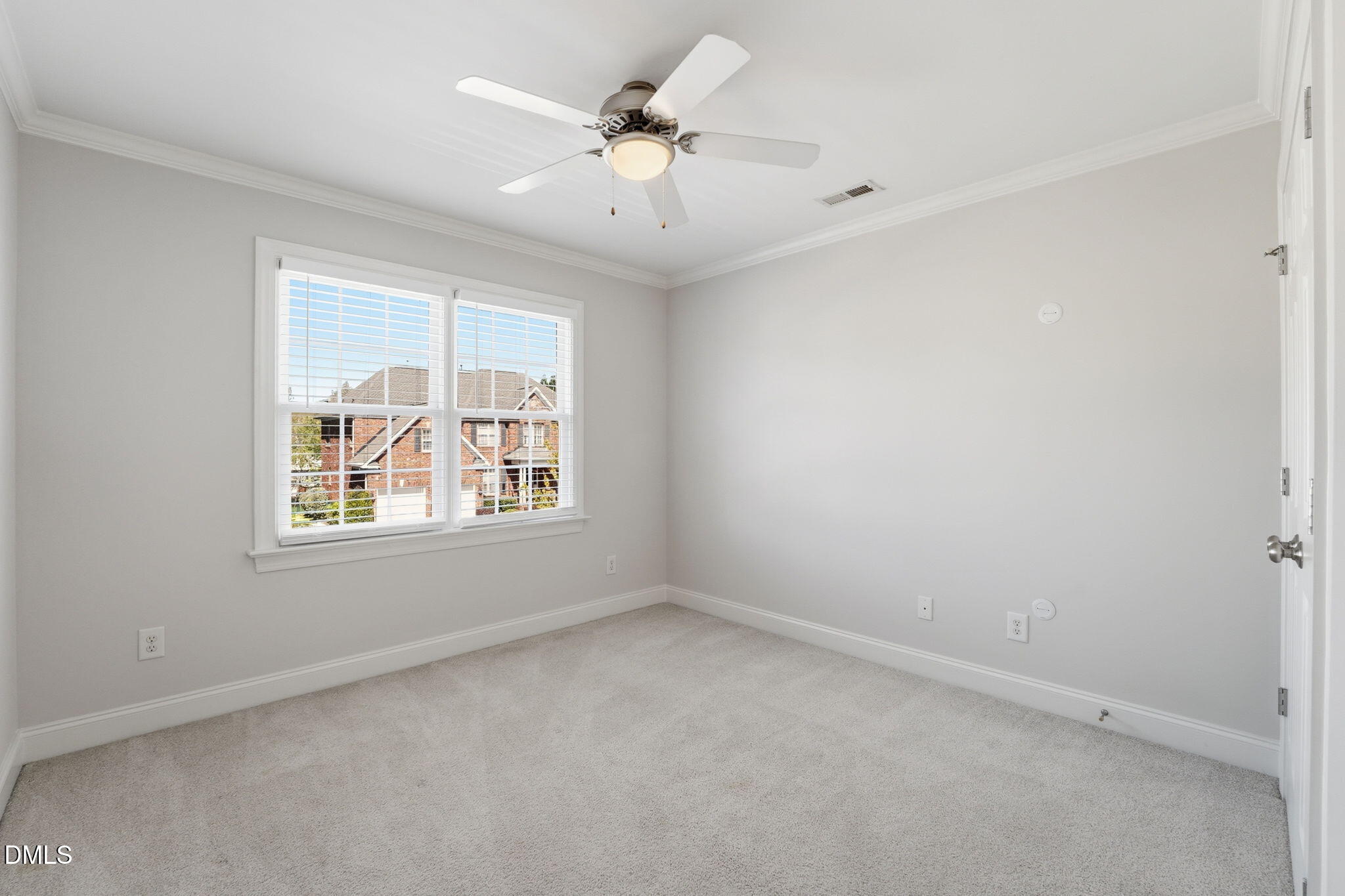 2900 SnapsWell Street Raleigh, NC 27614 - Photo 30 of 40 an empty room with a window and a fan