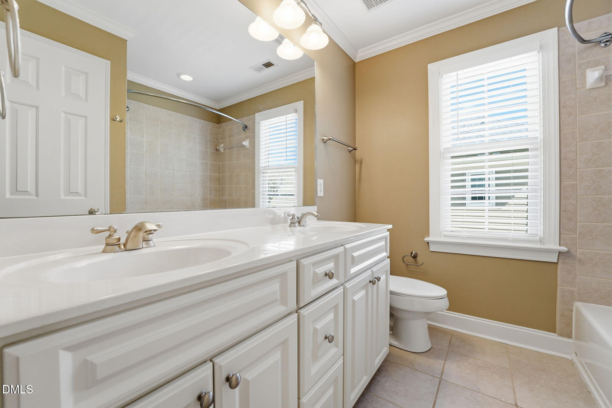 2900 SnapsWell Street Raleigh, NC 27614 - Photo 34 of 40 a bathroom with a granite countertop sink toilet a mirror and a tub
