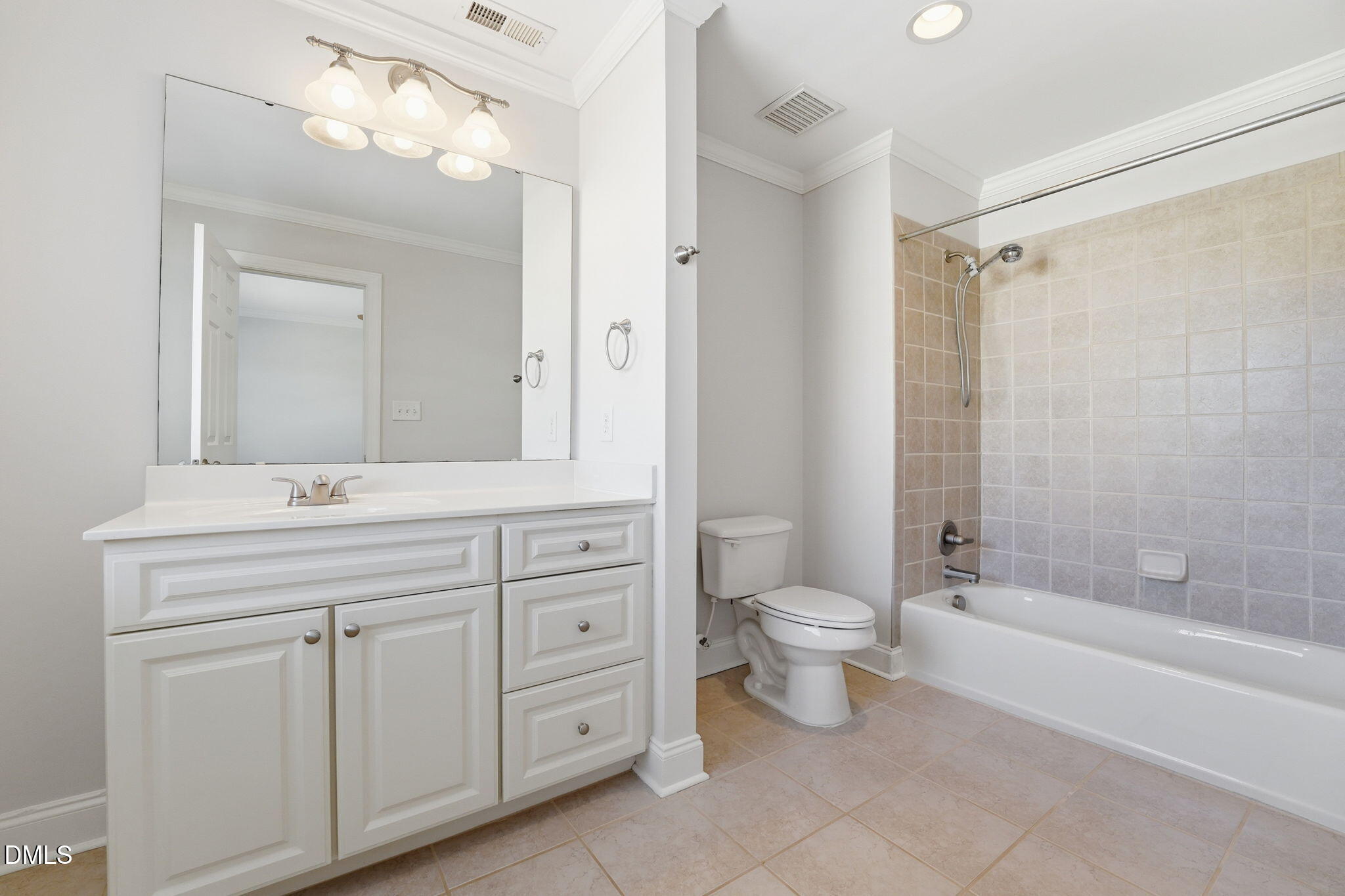 2900 SnapsWell Street Raleigh, NC 27614 - Photo 35 of 40 a bathroom with a double vanity sink a toilet a mirror and shower