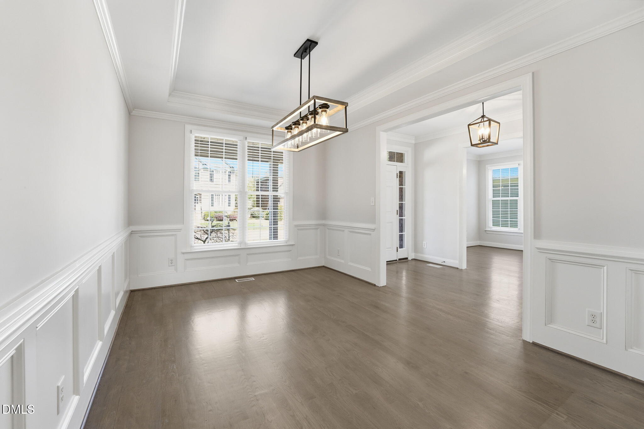 2900 SnapsWell Street Raleigh, NC 27614 - Photo 4 of 40 a view of an empty room with wooden floor and a window