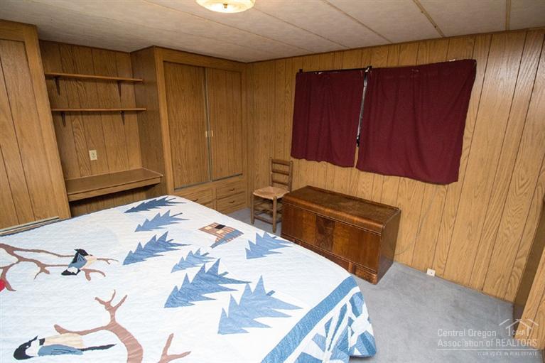 16804 Covina Road Bend, OR 97707 - Photo 11 of 16 a bedroom with a bed and a mirror