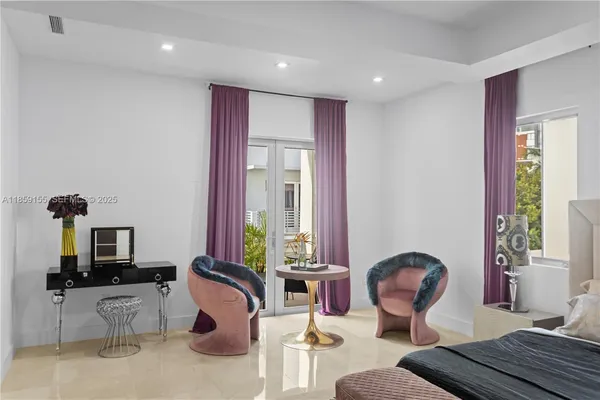 a bedroom with furniture and a window