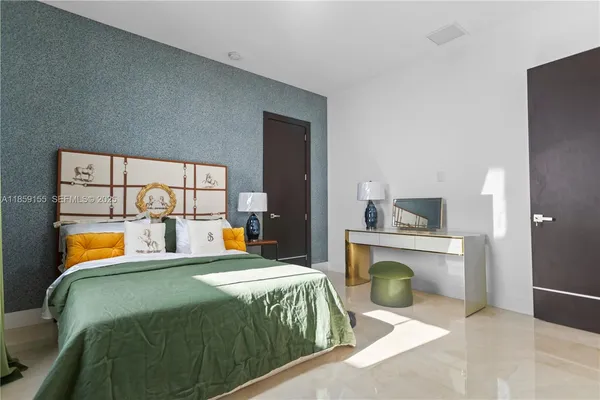 a view of kitchen with stainless steel appliances kitchen island granite countertop a sink and cabinets