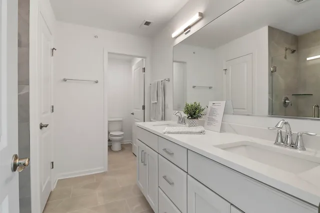 a bathroom with a sink a mirror and a bathtub