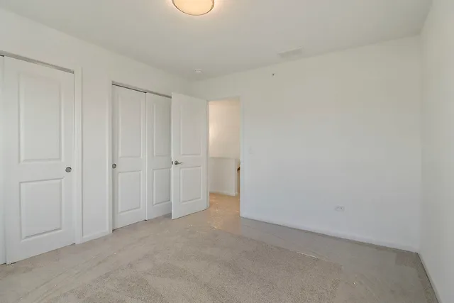 a view of a livingroom with furniture and a window