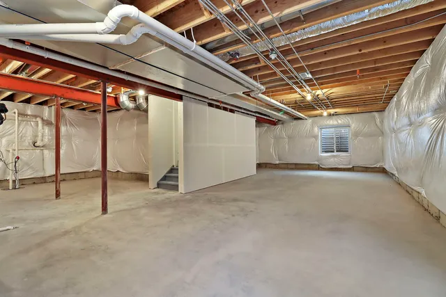 a view of empty room with wooden walls