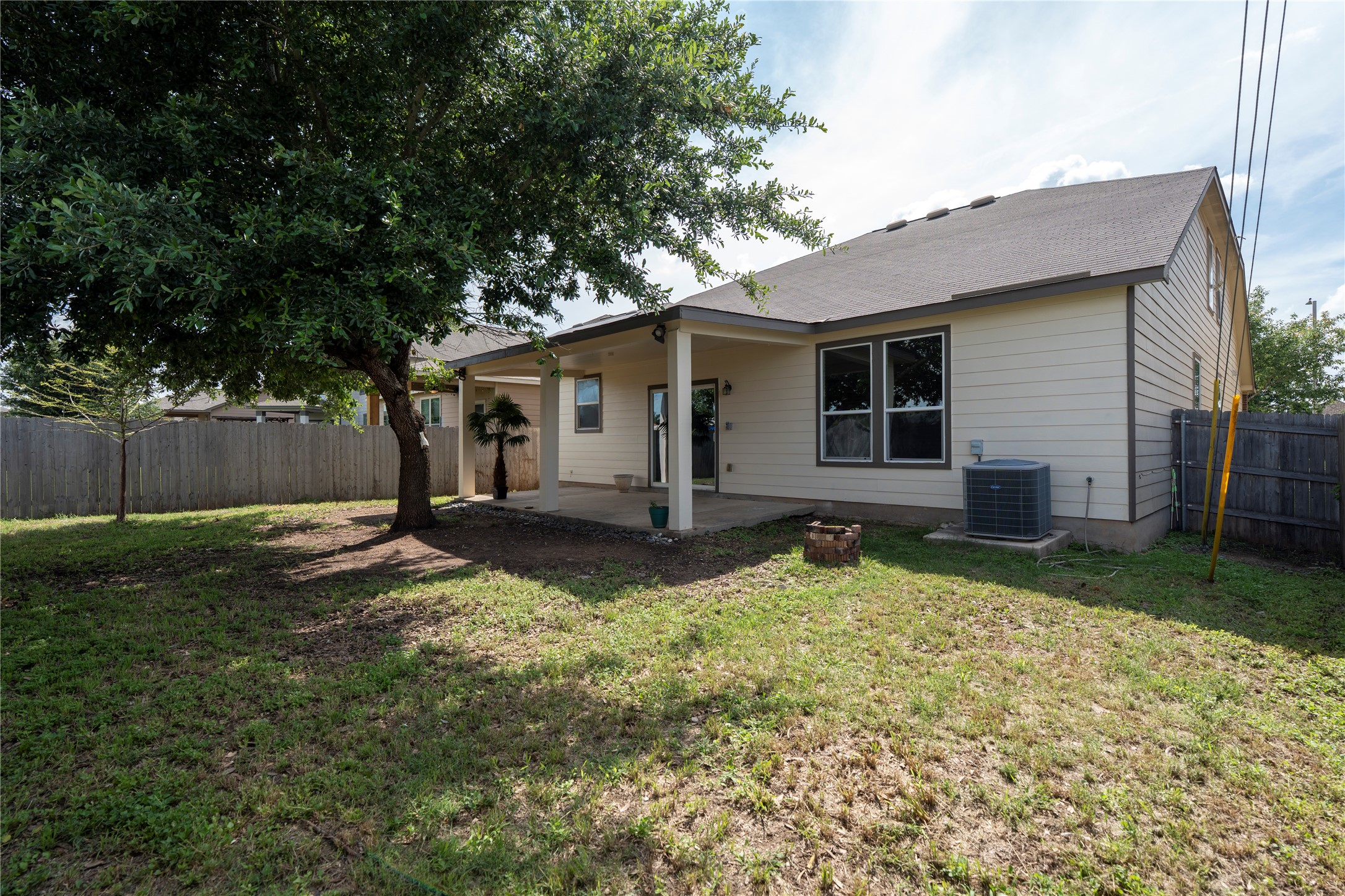 8613 Capitol View Drive Austin, TX 78747 - Photo 29 of 33 A spacious yard with a covered patio offers ample outdoor living space.