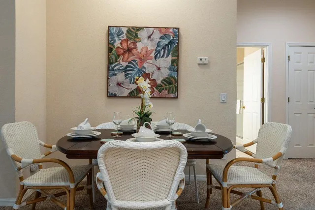 a dining room with furniture and window