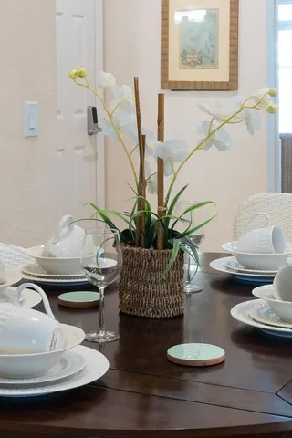 a dining room with furniture and wooden floor