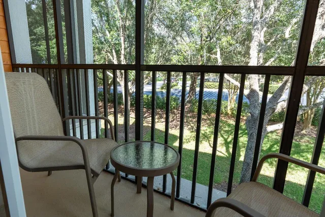 a view of a chairs and table in patio