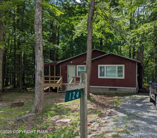 a view of a house with backyard porch and sitting area
