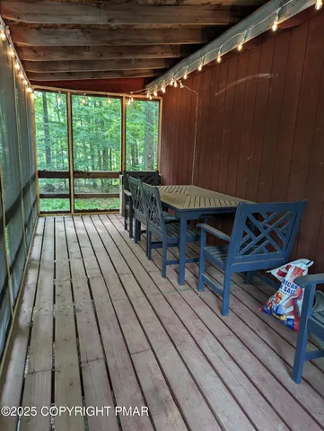 a balcony with wooden floor