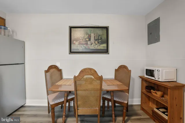 a view of a dining room with furniture and a window
