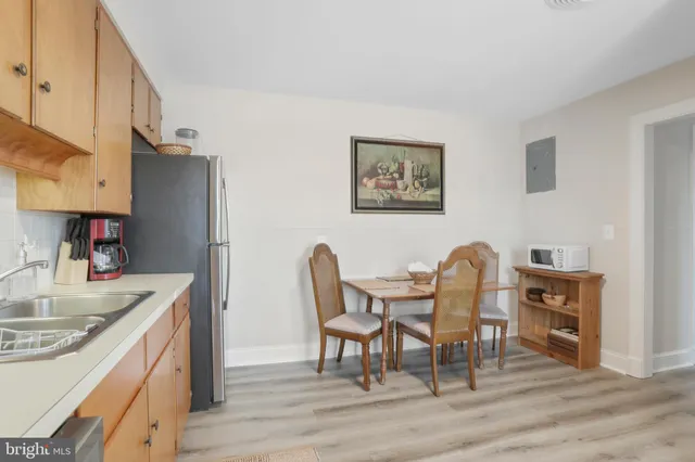 a view of kitchen and dining area with furniture