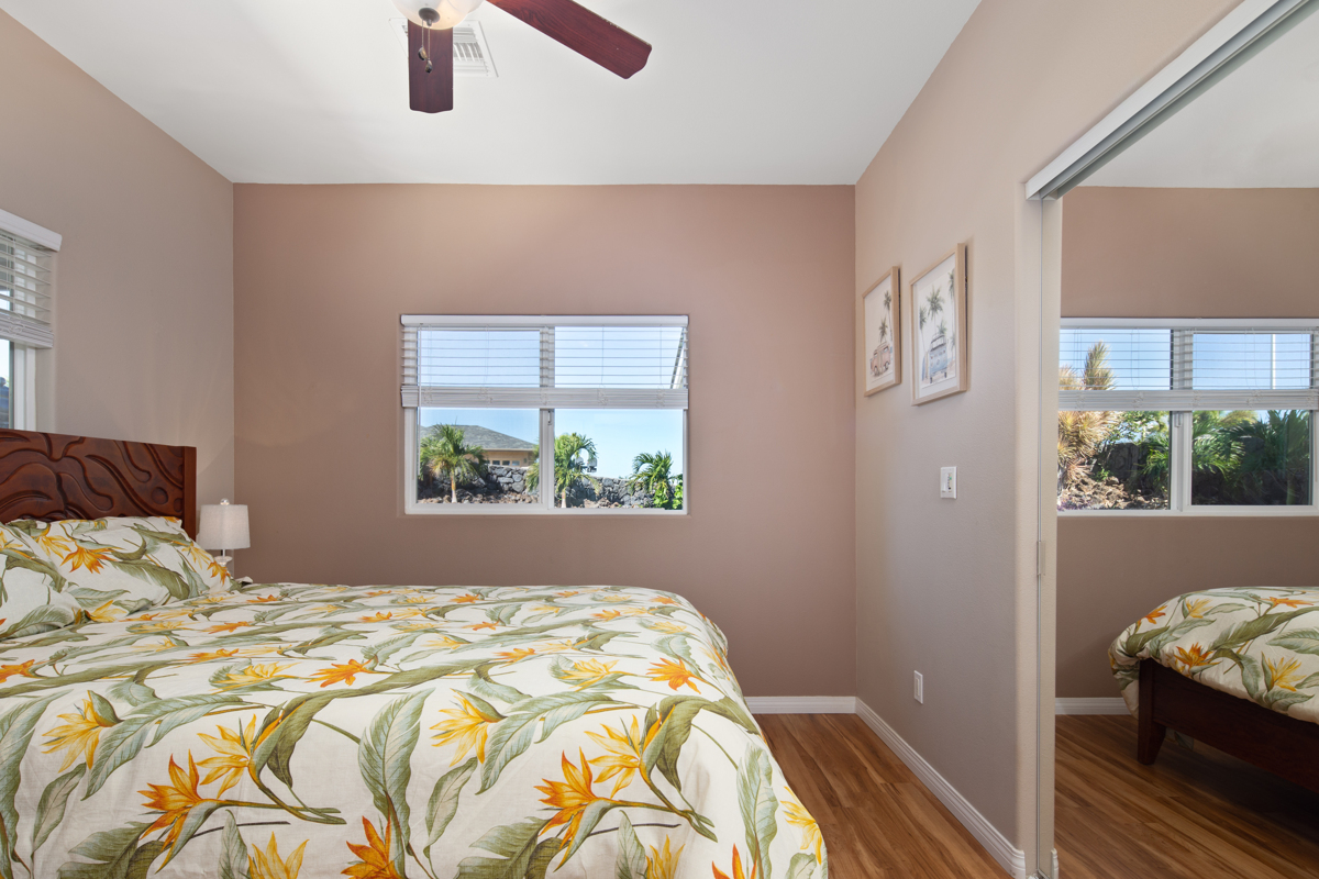 68-1736 Ka'apuni Street Waikoloa, HI 96738 - Photo 16 of 30 a bedroom with a bed and a window