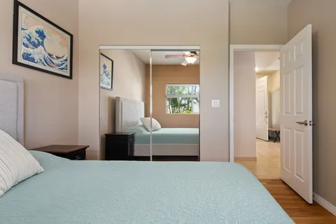 a bedroom with a bed and a view of bathroom