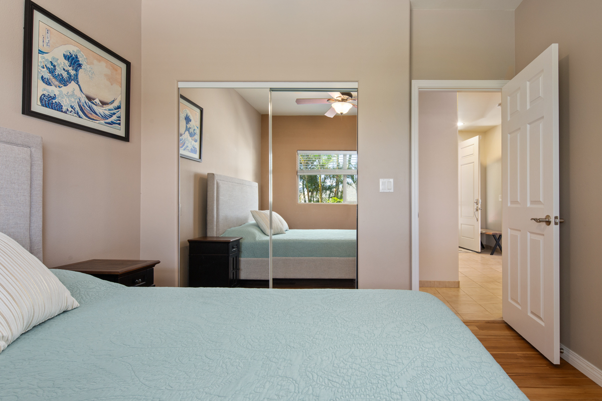 68-1736 Ka'apuni Street Waikoloa, HI 96738 - Photo 19 of 30 a bedroom with a bed and a view of bathroom