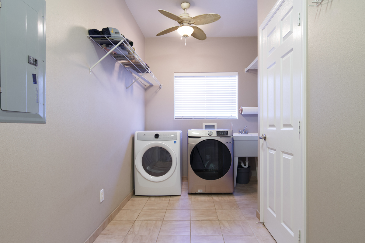 68-1736 Ka'apuni Street Waikoloa, HI 96738 - Photo 20 of 30 a utility room with dryer and washer