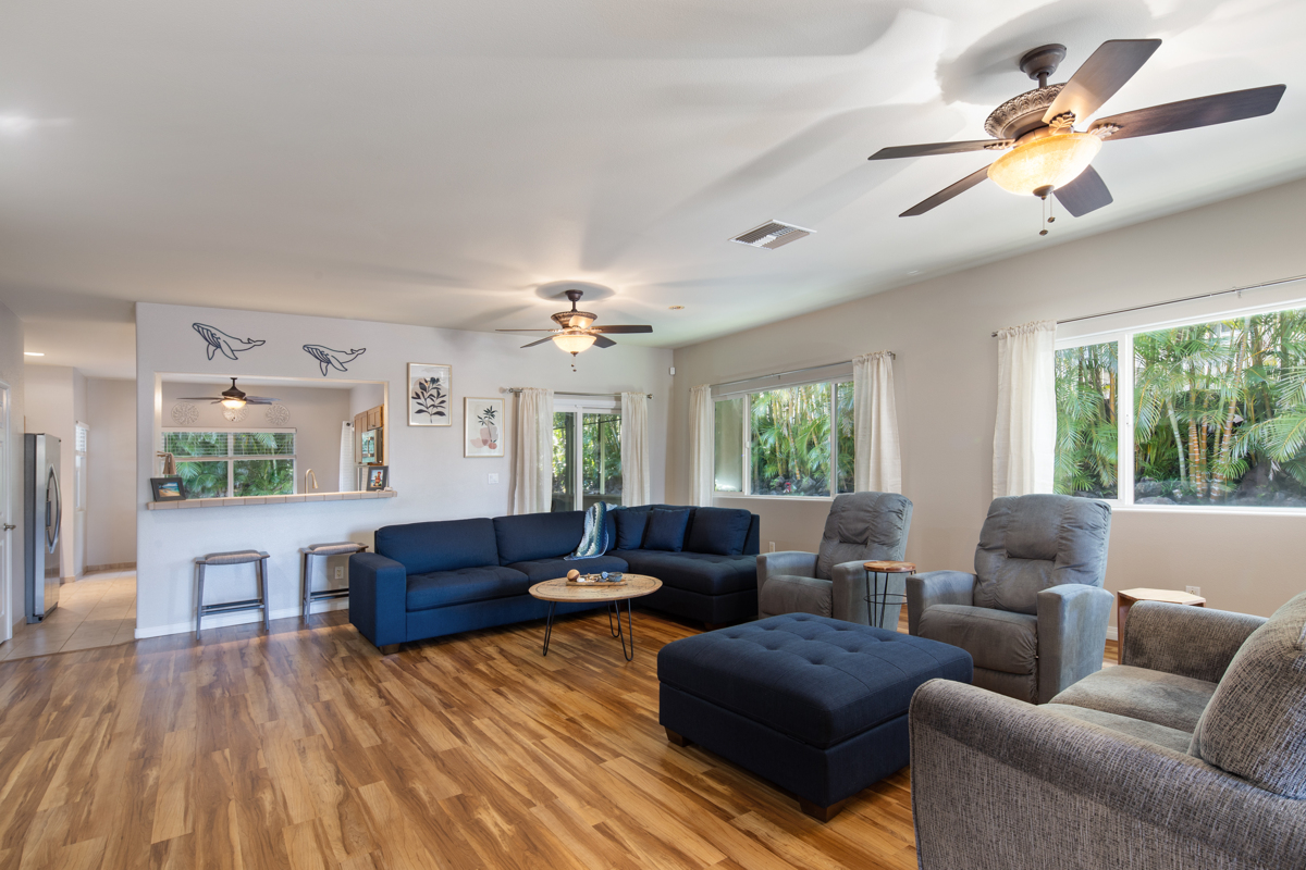 68-1736 Ka'apuni Street Waikoloa, HI 96738 - Photo 2 of 30 a living room with furniture and a large window