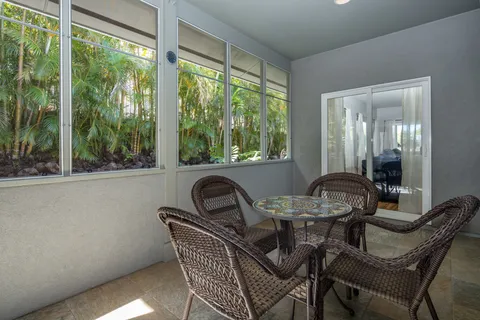 a dining room with furniture and windows
