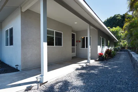 a view of a house with backyard