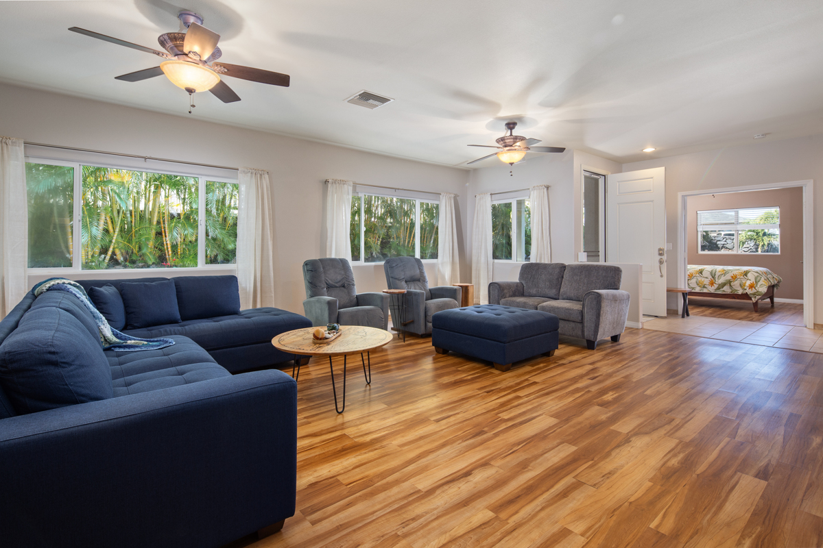 68-1736 Ka'apuni Street Waikoloa, HI 96738 - Photo 5 of 30 a living room with furniture and a chandelier
