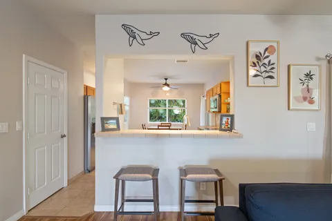 a view of a dining room with furniture and window
