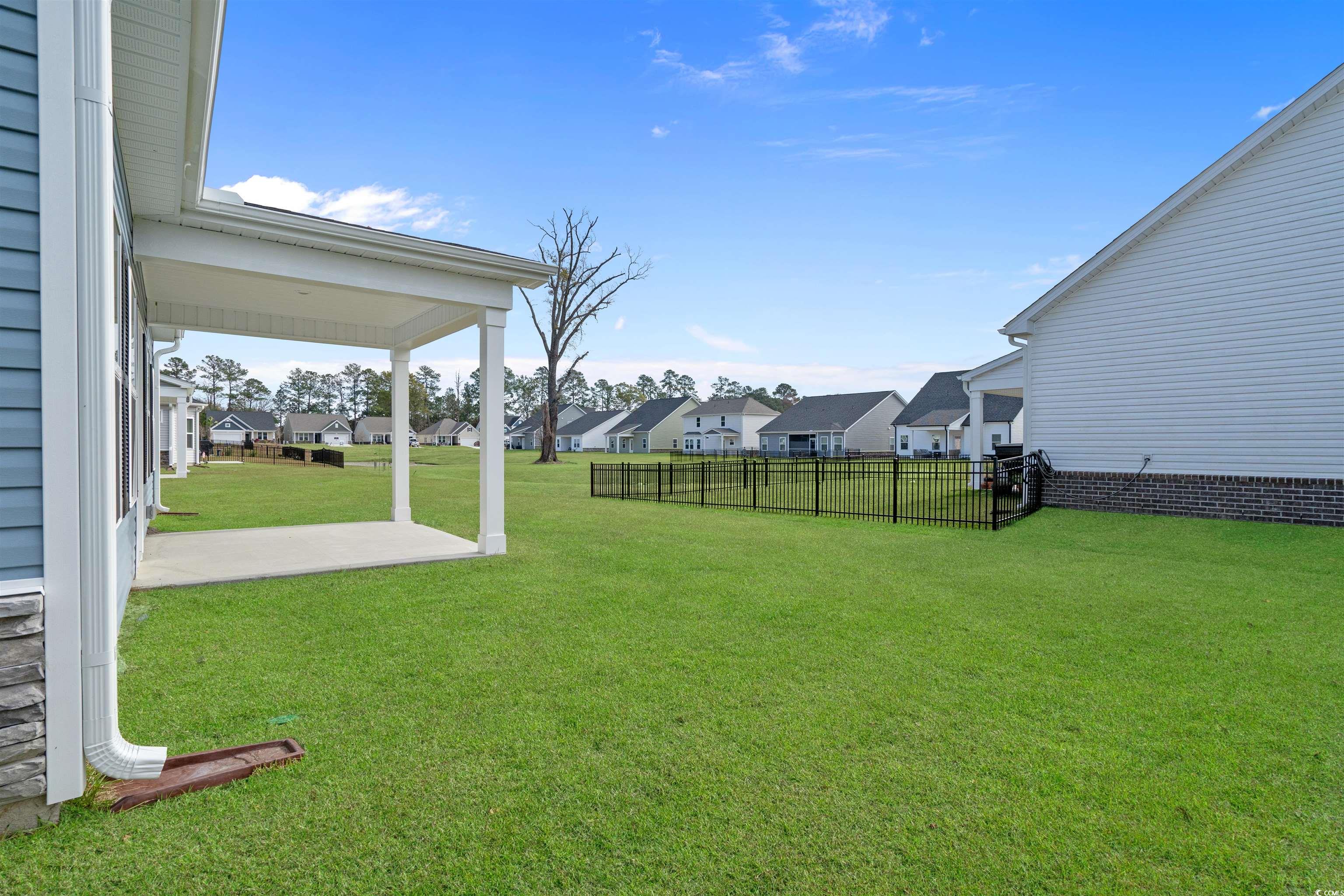2494 Campton Loop Conway, SC 29527 - Photo 17 of 40 Fenced backyard with a residential view and a patio area