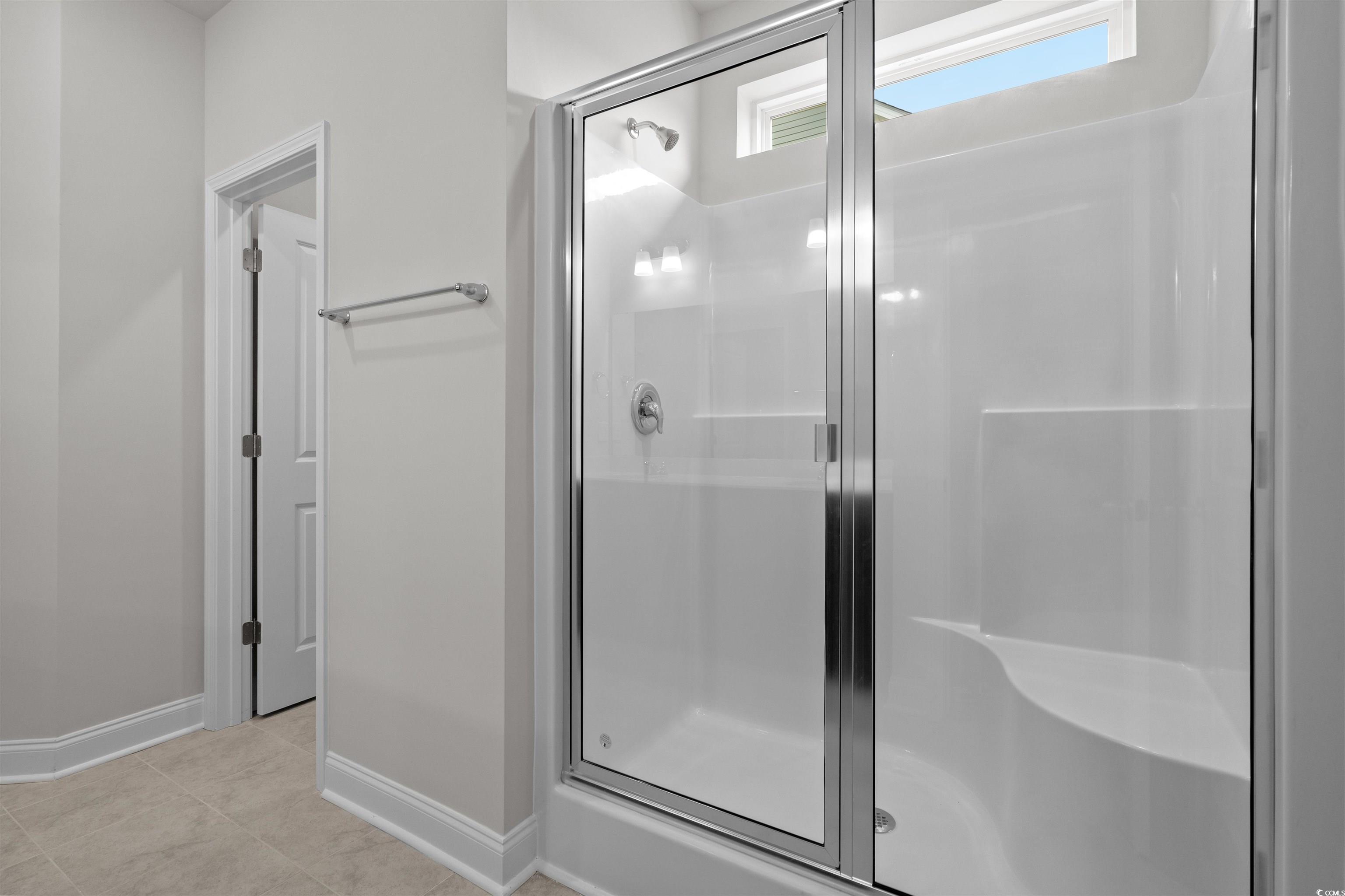 2494 Campton Loop Conway, SC 29527 - Photo 22 of 40 Bathroom featuring a shower stall and light tile patterned floors